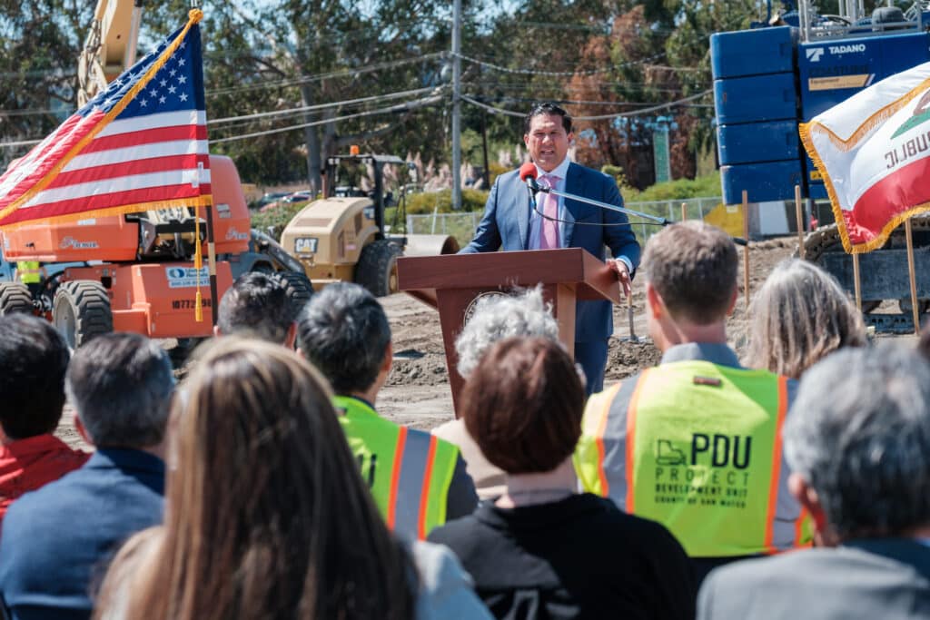 San Mateo County Supervisor David Canepa, center, recognizes Sam Lin of the County's Project Development Unit, left, and Deputy County Executive Adam Ely for their work on the Wellness Center.