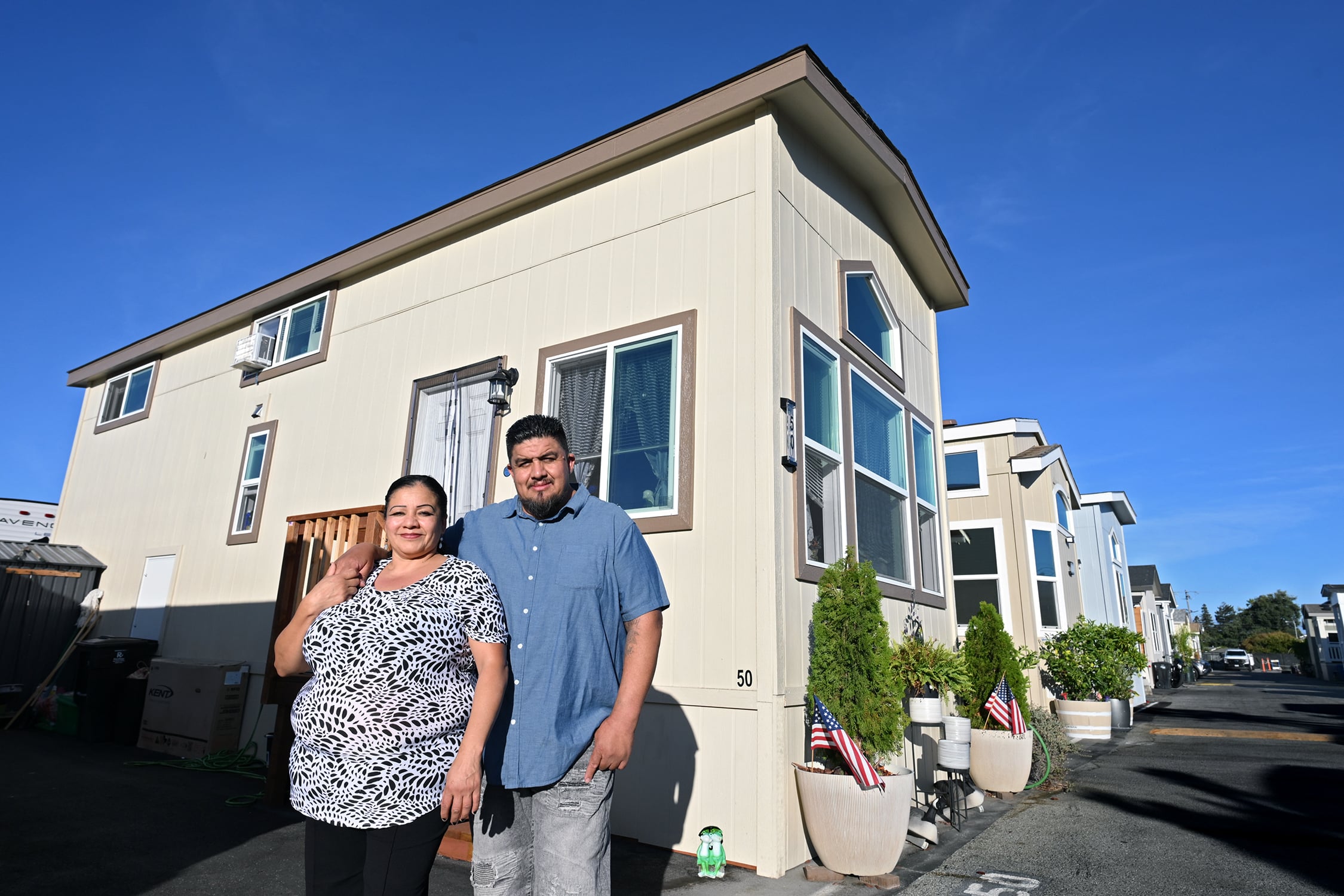 The couple outside their home.